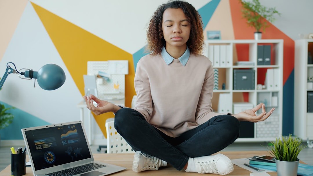 A serene scene depicting a person practicing mindfulness or engaging in a simple wellness routine, such as meditating or enjoying a healthy meal.