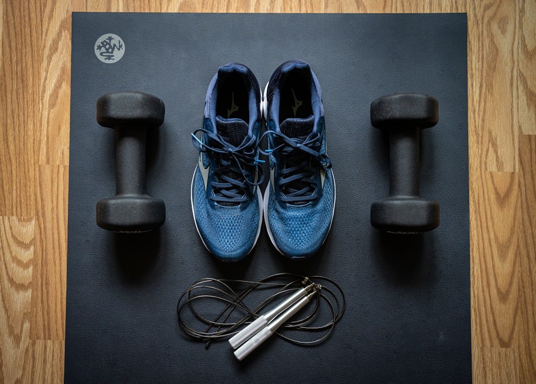 A person engaging in a simple fitness activity, such as stretching or using a resistance band in a home setting.