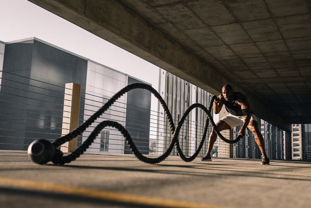 A person exercising regularly, showcasing a routine that emphasizes consistency in fitness, such as running, weightlifting, or yoga.
