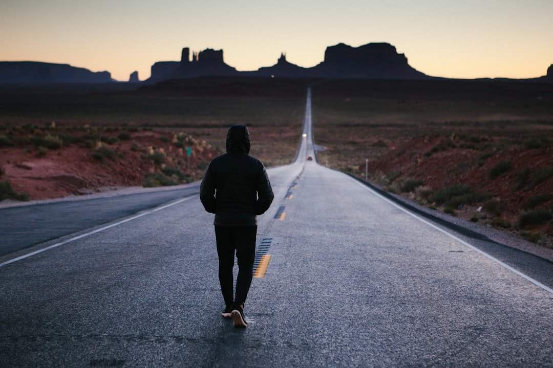 A person jogging on a scenic trail, embodying motivation and determination in their fitness journey.
