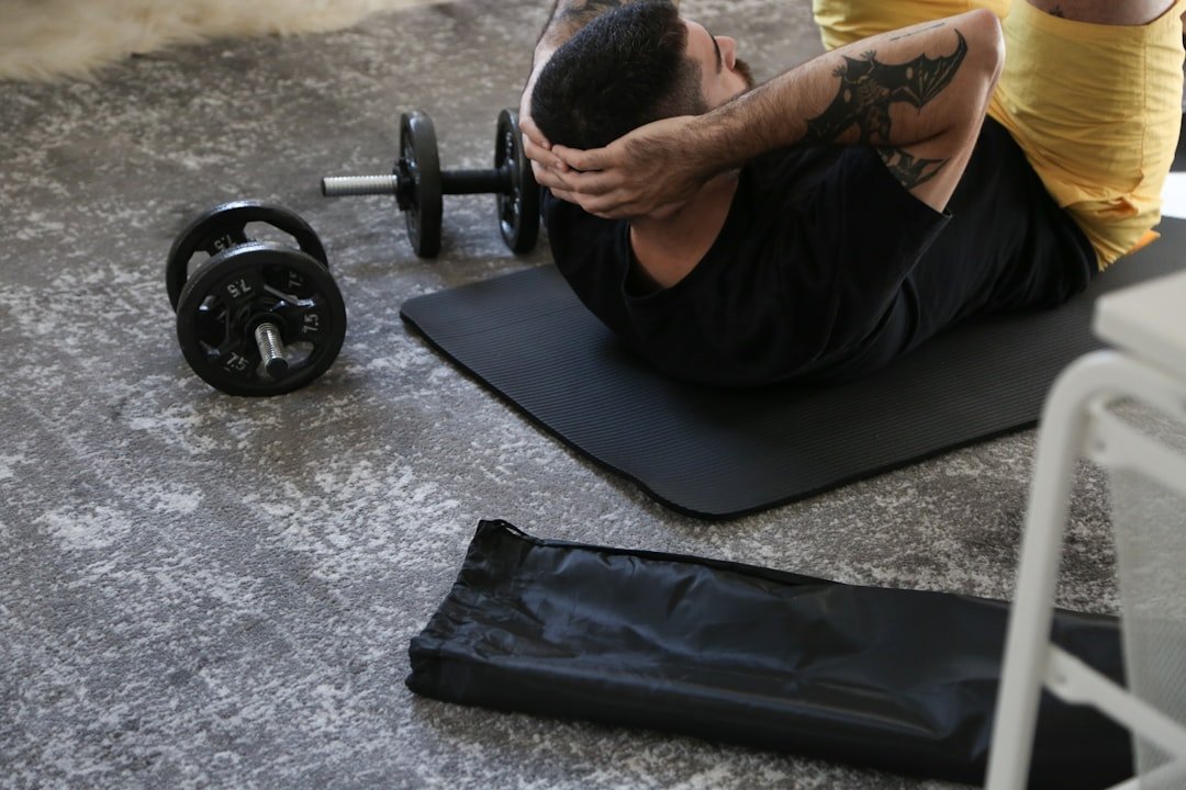 A person exercising at home with minimal equipment, showcasing a living room setup for fitness.