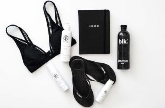 A collection of wellness items including healthy food, fitness equipment, and relaxation tools arranged aesthetically.
